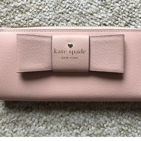 kate spade Accessories - Original, authentic Kate Spade purse. BNWT Lovely pink colour with bow detail.